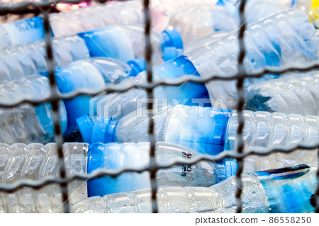 Plastic bottles and containers prepared for recycling Plastic bottles and containers prepared for recycling 86558250