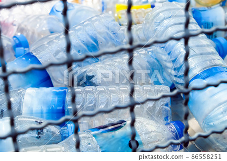 Plastic bottles and containers prepared for recycling Plastic bottles and containers prepared for recycling 86558251