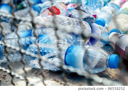 Plastic bottles and containers prepared for recycling Plastic bottles and containers prepared for recycling 86558252