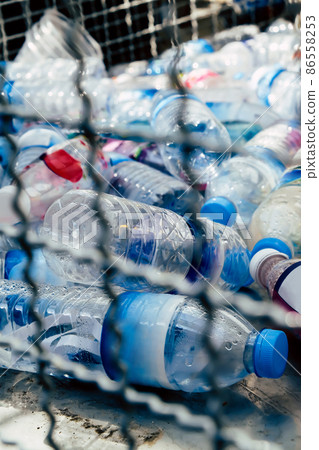 Plastic bottles and containers prepared for recycling Plastic bottles and containers prepared for recycling 86558253