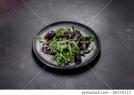 Fresh delicious salad with sleeves, spinach and beet leaves with olive oil 86559117