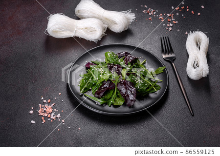 Fresh delicious salad with sleeves, spinach and beet leaves with olive oil 86559125
