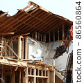 Demolition work site demolition vacant lot real estate housing rebuilding demolition work site heavy machinery construction work chipping 86560864