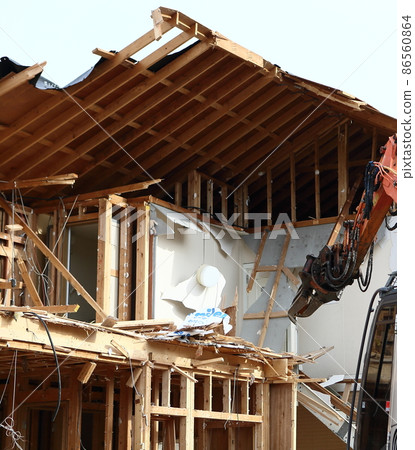 Demolition work site demolition vacant lot real estate housing rebuilding demolition work site heavy machinery construction work chipping 86560864