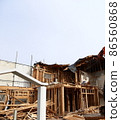 Demolition work site demolition vacant lot real estate housing rebuilding demolition work site heavy machinery construction work chipping 86560868