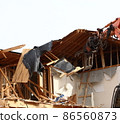 Demolition work site demolition vacant lot real estate housing rebuilding demolition work site heavy machinery construction work chipping 86560873
