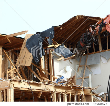 Demolition work site demolition vacant lot real estate housing rebuilding demolition work site heavy machinery construction work chipping 86560874