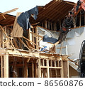 Demolition work site demolition vacant lot real estate housing rebuilding demolition work site heavy machinery construction work chipping 86560876