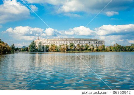 Congress Hall in Nuremberg, view from the lake. water surface and blue sky 86560942