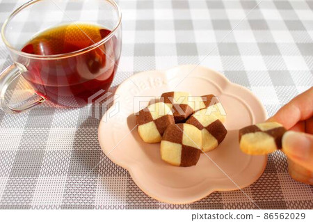 Have cookies and tea for a snack Have cookies and tea for a snack 86562029
