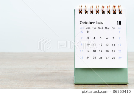 October 2022 desk calendar on wooden background. October 2022 desk calendar on wooden background. 86563410