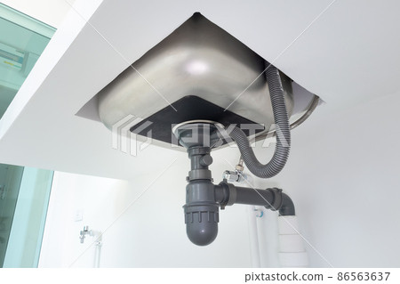 Drain pipe or sewer under kitchen sink in drainage system. Drain pipe or sewer under kitchen sink in drainage system. 86563637