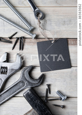 International Father's Day. Greeting card. Work tools on a gray wooden background. International Father's Day. Greeting card. Work tools on a gray wooden background. 86563662