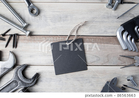 International Father's Day. Greeting card. Work tools on a gray wooden background. International Father's Day. Greeting card. Work tools on a gray wooden background. 86563663