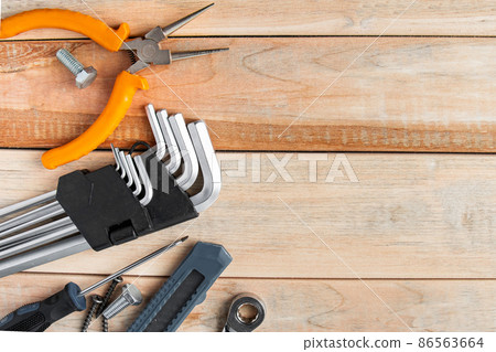 International Father's Day. Greeting card concept. Set of construction tools on a wooden background. Place for text. International Father's Day. Greeting card concept. Set of construction tools on a wooden background. Place for text. 86563664