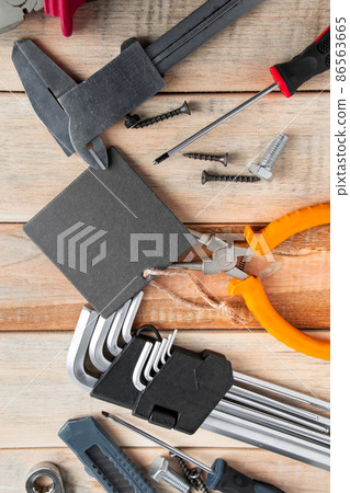 Set of work tools on a wooden background. Festive greeting card concept for Father's day Set of work tools on a wooden background. Festive greeting card concept for Father's day 86563665