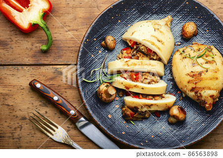 Grilled squid with mushroom stuffing 86563898