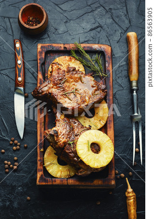 Meat grilled with pineapple rings. Meat grilled with pineapple rings. 86563905