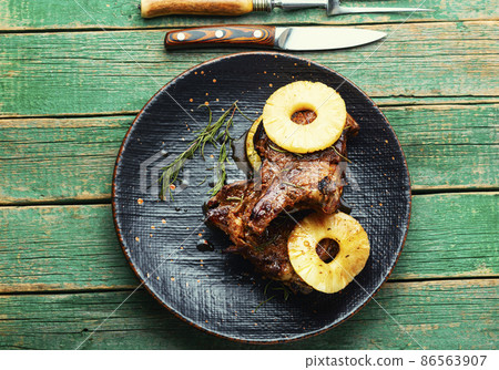 Meat barbecue with pineapple rings. Meat barbecue with pineapple rings. 86563907