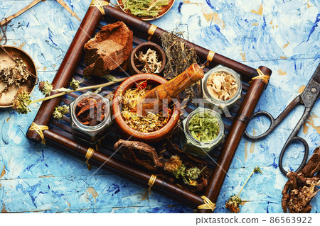 Tray with healing herbs. 86563922