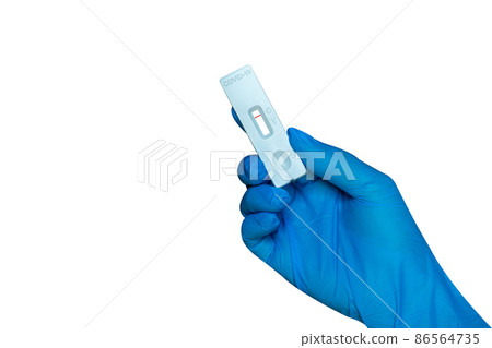 Hand holding Rapid Antigen Test kit (ATK)with Negative result during swab COVID-19 testing. Hand holding Rapid Antigen Test kit (ATK)with Negative result during swab COVID-19 testing. 86564735