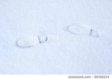 Shoe marks on the snow 86566634