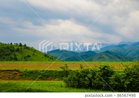 Mountains and dark sky on a rainy morning. Out of focus, nature background. 86567498
