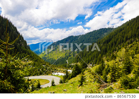 Road through the romantic wild Romanian Carpathians. Road through the romantic wild Romanian Carpathians. 86567530