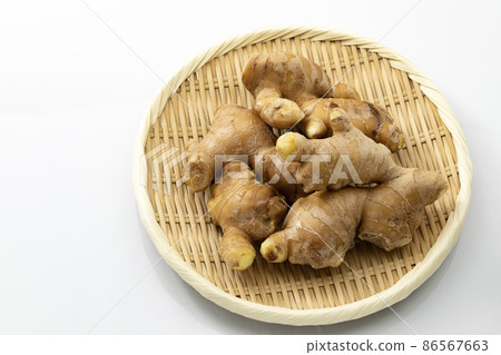 Ginger on a colander_white background Ginger on a colander_white background 86567663