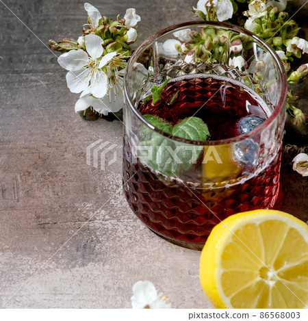Cocktail glass with blueberry sparkling cider or lemonade 86568003
