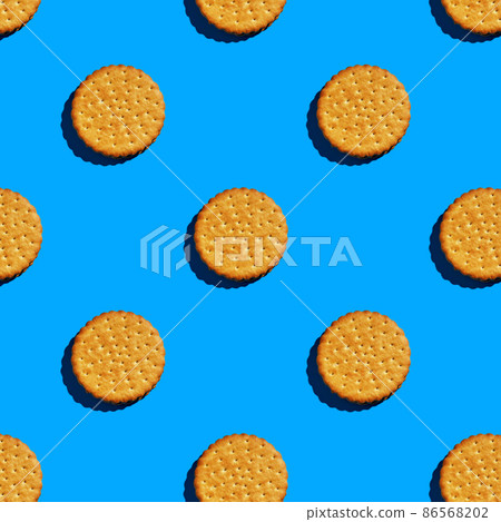 Double chocolate chip cookies on a blue background, arranged one after the other 86568202