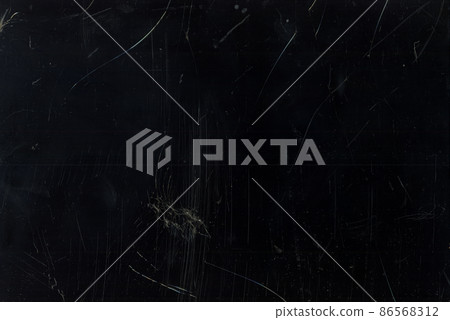 Broken glass texture. Dust scratches overlay. Fractured screen. Grunge distressed dirty window with smeared fingerprints stains on dark black abstract layer. 86568312
