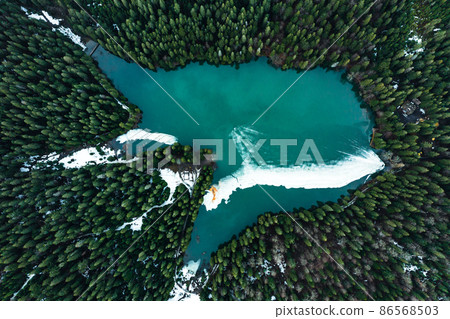 Lake Synevyr in the Carpathians of Ukraine, the lake was taken from a drone, the view of the lake from above. Lake Synevyr in the Carpathians of Ukraine, the lake was taken from a drone, the view of the lake from above. 86568503