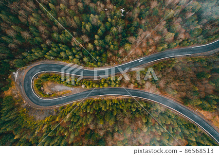 Serpentine roads in Ukraine, fog in the mountains, serpentine road in the fog, drove on top of the road. Serpentine roads in Ukraine, fog in the mountains, serpentine road in the fog, drove on top of the road. 86568513
