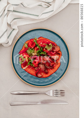 fillet and fresh vegetable salad of lettuce, arugula, spinach, cucumber and tomato. Healthy lunch menu. Diet food. 86568815