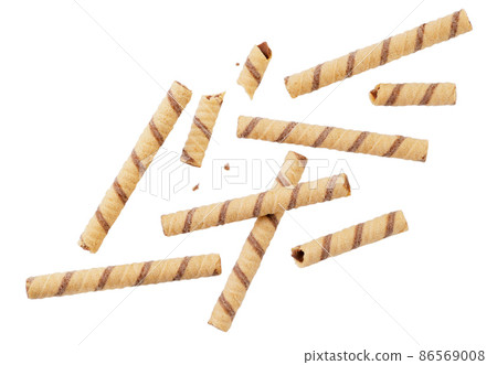 Wafer rolls striped whole and pieces falling on a white background, cut. Isolated Wafer rolls striped whole and pieces falling on a white background, cut. Isolated 86569008