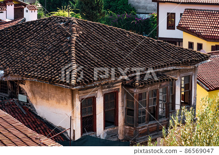 view of the tiled roofs of ancient houses in the historical center of Antalya, Turkey view of the tiled roofs of ancient houses in the historical center of Antalya, Turkey 86569047