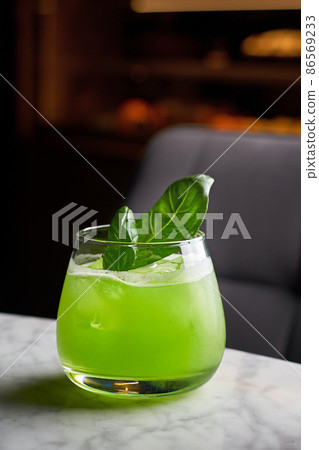 Close up shot of basil cocktail in a glass 86569233