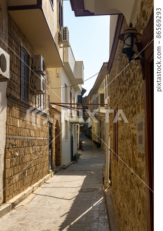 narrow winding streets of Kaleici, historic city center of Antalya, Turkey 86569293
