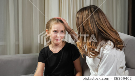 Teen girl complains crying while mother calms daughter Teen girl complains crying while mother calms daughter 86569402