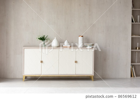 White modern dresser minimalistic furniture in empty room 86569612