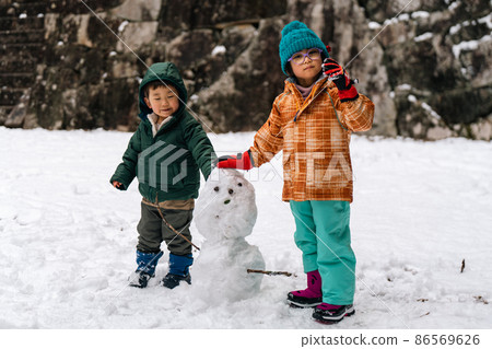 Image of a child playing in the snow Boys and girls 86569626
