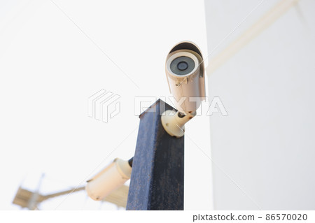 Outdoor video camera on the building, close-up 86570020