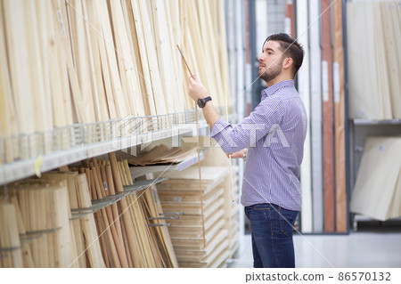 male shopping on hardware store 86570132