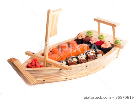 Japanese cuisine. Sushi and rolls set isolated on white background. 86570619