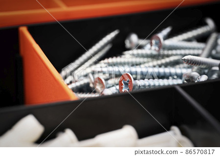 Close up of pile of metal screws in a toolbox Close up of pile of metal screws in a toolbox 86570817