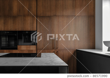 Modern minimalistic kitchen with black and wooden surfaces, marble kitchen island top and household appliances. Modern Concept For Interior Design And Architecture. Modern minimalistic kitchen with black and wooden surfaces, marble kitchen island top and household appliances. Modern Concept For Interior Design And Architecture. 86571990