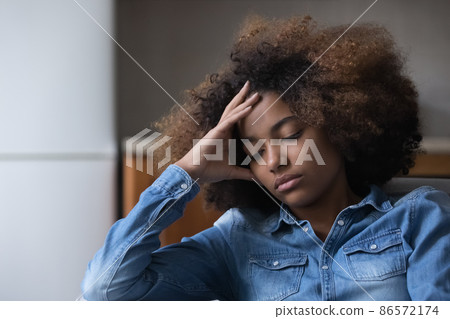 Frustrated unhappy African teen girl suffering from depression Frustrated unhappy African teen girl suffering from depression 86572174