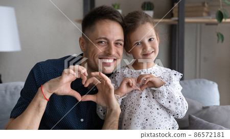 Bonding happy friendly two generations family looking at camera. 86572181