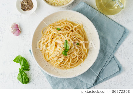 Cacio e pepe pasta. Spaghetti with parmesan cheese and pepper. Cacio e pepe pasta. Spaghetti with parmesan cheese and pepper. 86572208